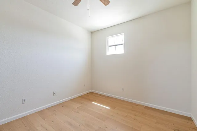 an empty room with a empty space and a window