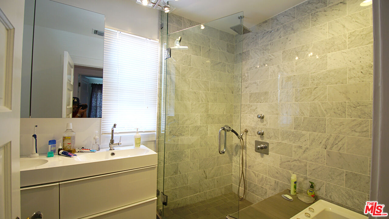 1722 Nichols Canyon Road Los Angeles, CA 90046 - Photo 11 of 11 a bathroom with a sink and mirror