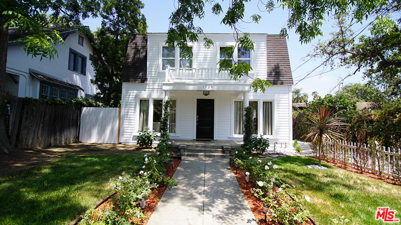 1722 Nichols Canyon Road Los Angeles, CA 90046 - Photo 2 of 11 a front view of a house with a yard