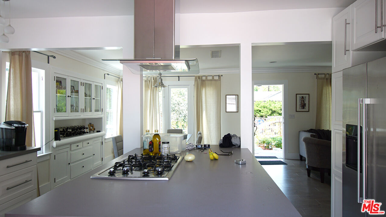 1722 Nichols Canyon Road Los Angeles, CA 90046 - Photo 5 of 11 a living room with furniture and a flat screen tv
