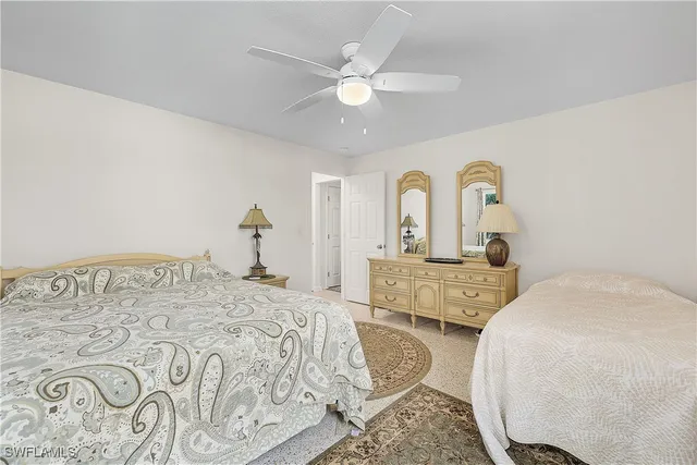 a bedroom with a large bed and closet