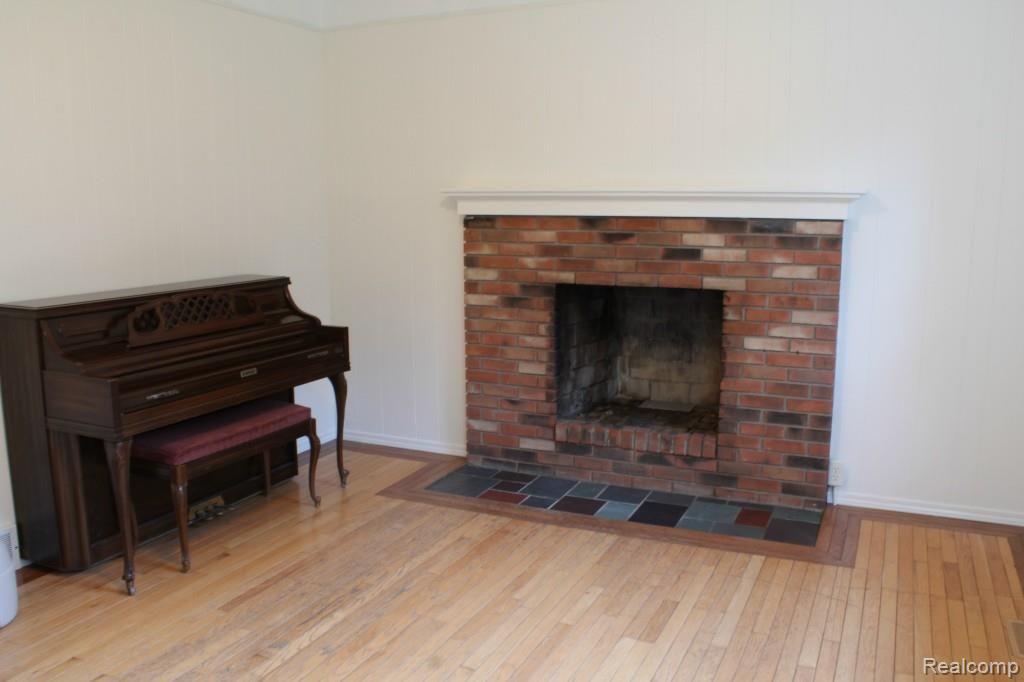 6544 General Squier Road Almont, MI 48003 - Photo 35 of 53 Family room with natural fireplace and hardwood floors!