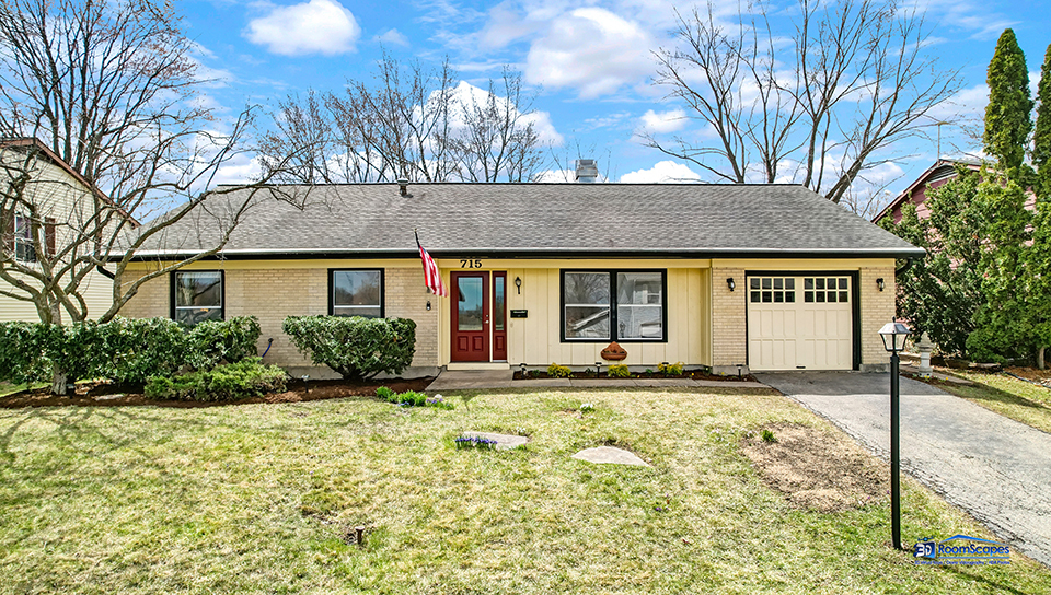 front view of a house with a yard