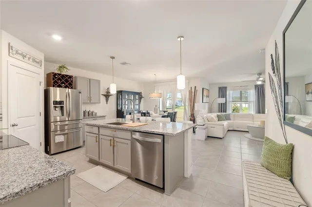 a large kitchen with a table and chairs