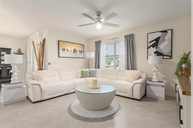 a dining room with stainless steel appliances kitchen island a table and chairs