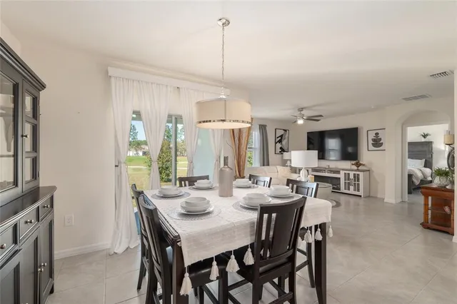 a kitchen with granite countertop a stove a sink and a microwave