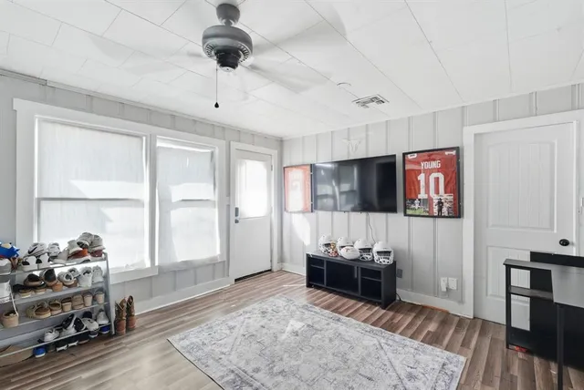 a living room with furniture and a flat screen tv