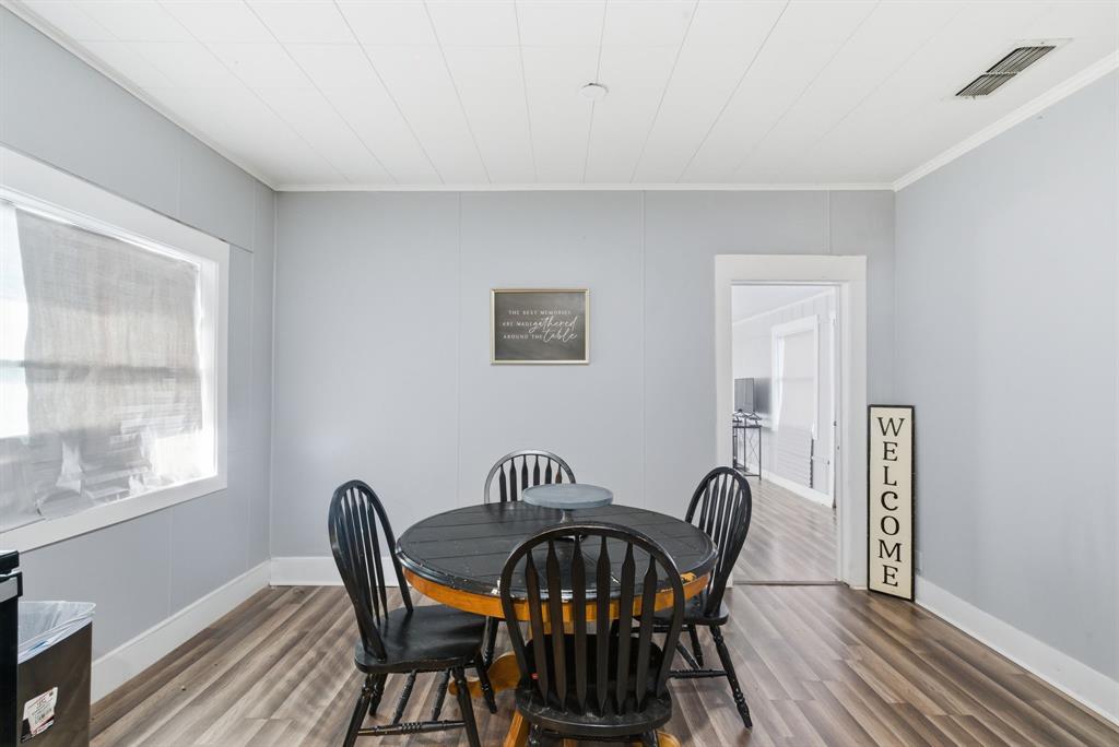 1317 4th Street Graham, TX 76450 - Photo 9 of 25 Dining room with crown molding and light wood-type flooring