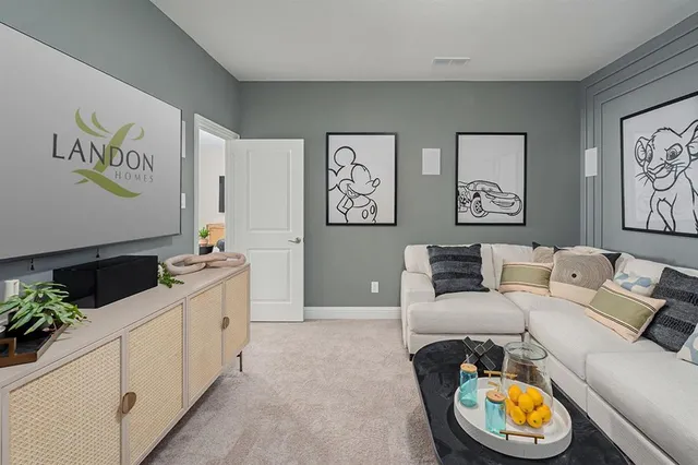 a living room with furniture and flowers