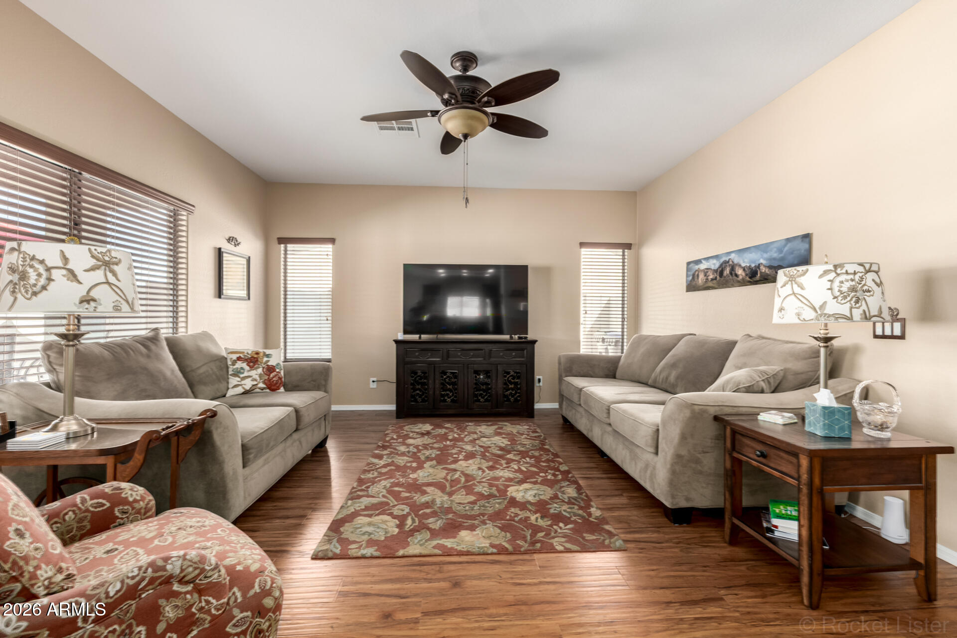 2756 South Powell Road Apache Junction, AZ 85119 - Photo 5 of 37 a living room with furniture and a flat screen tv