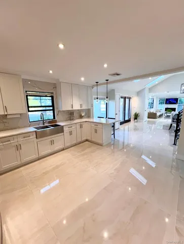 a view of a swimming pool and a yard