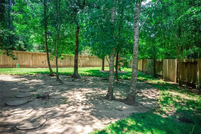 a view of a tree in front of a house