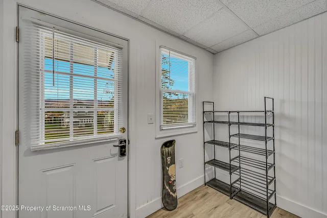 a view of a room that has a bed and a window