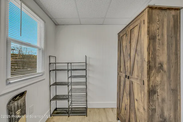 a bathroom with a shower and a window