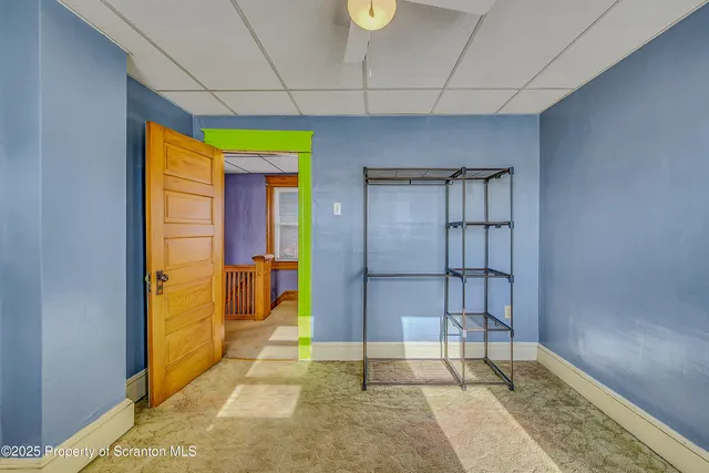 a view of a room that has a bed and a window