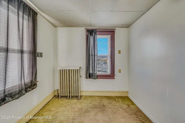 a bathroom with a toilet sink and shower