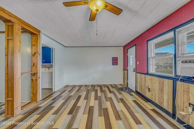 a view of a balcony with wooden floor