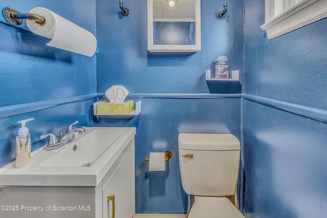 a bathroom with a toilet and a sink