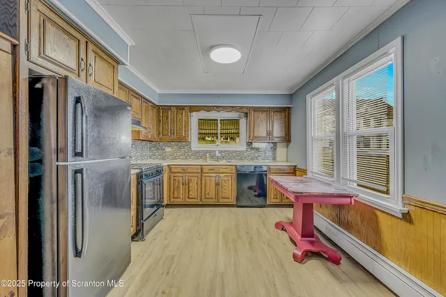 a kitchen with a sink appliances and cabinets