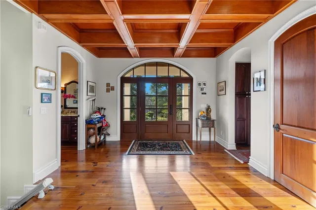 a view of a livingroom with wooden floor and a rug