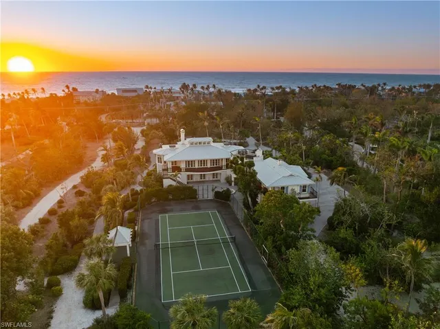a living room with furniture a rug and a large window