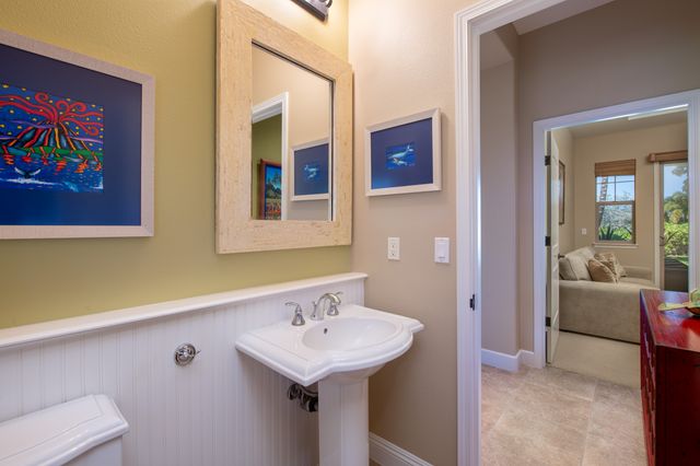 a spacious bedroom with a bed and a couch