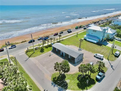 an aerial view of a house with a garden