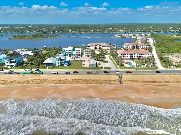an aerial view of residential building with lake view