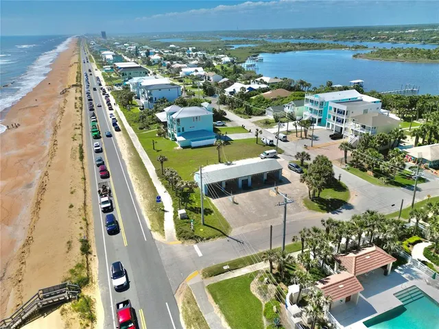 an aerial view of residential houses with outdoor space
