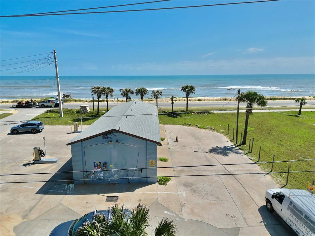 2299 North Ocean Shore Boulevard Flagler Beach, FL 32136 - Photo 10 of 12 a view of a swimming pool with a yard