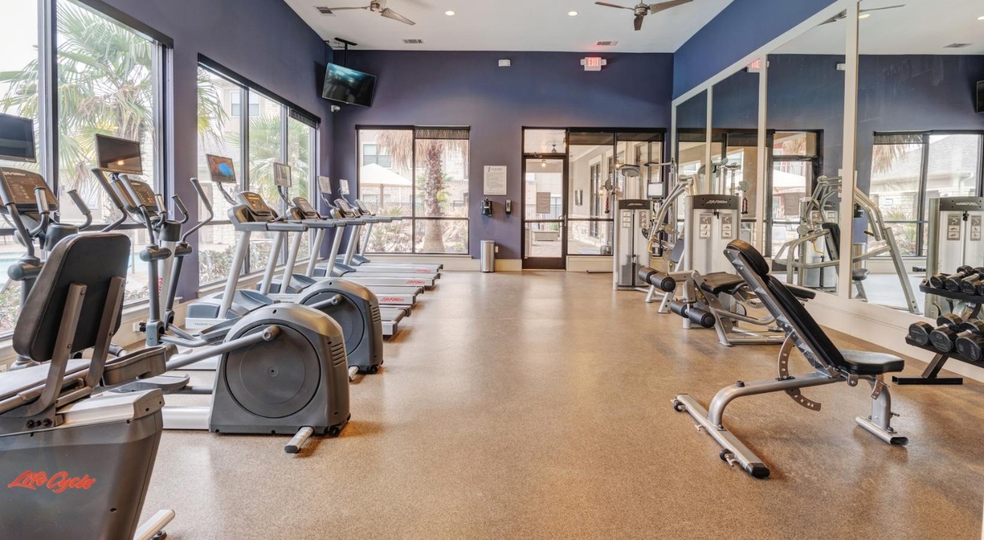 2539 Spring Cypress Road, Unit 7311 Spring, TX 77388 - Photo 6 of 13 a view of a room with gym equipment