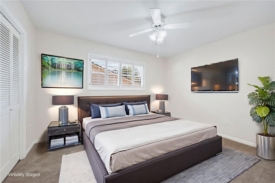 2810 Hillside Drive Bryan, TX 77802 - Photo 15 of 22 a bedroom with a bed and a flat screen tv