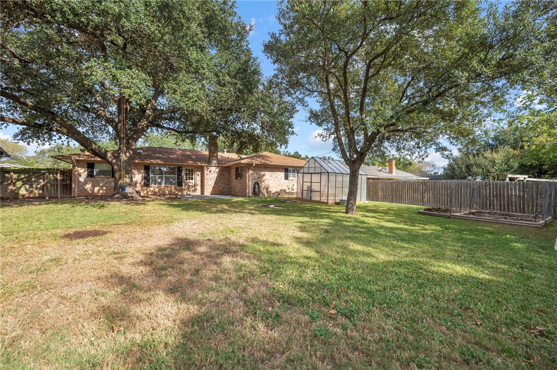 2810 Hillside Drive Bryan, TX 77802 - Photo 20 of 22 a view of a house with a backyard