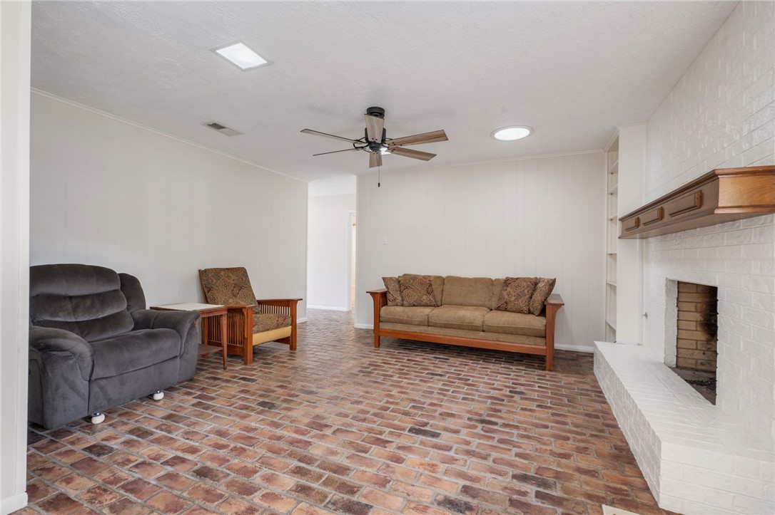 2810 Hillside Drive Bryan, TX 77802 - Photo 6 of 22 a living room with furniture and a fireplace