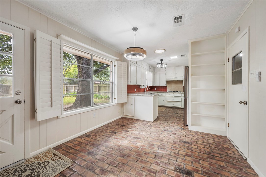 2810 Hillside Drive Bryan, TX 77802 - Photo 9 of 22 a kitchen with stainless steel appliances granite countertop a refrigerator and a sink