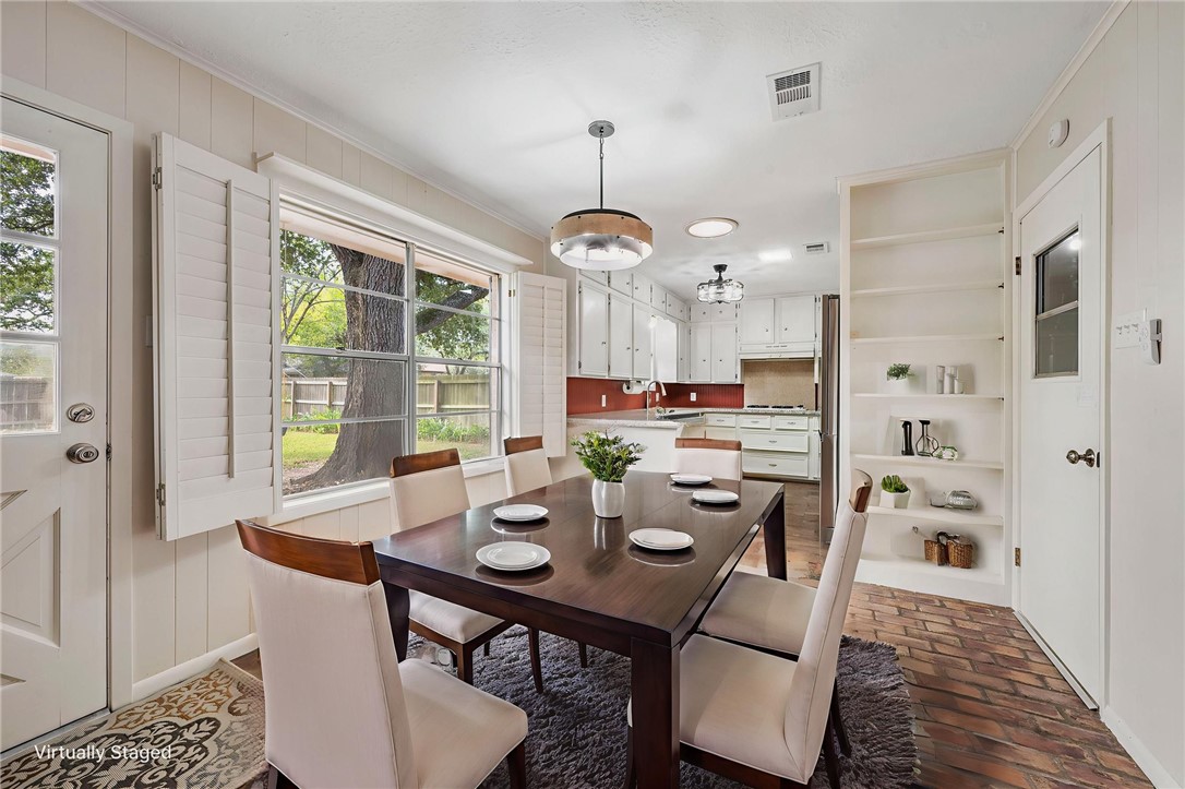 2810 Hillside Drive Bryan, TX 77802 - Photo 10 of 22 a view of a dining room with furniture window and outside view