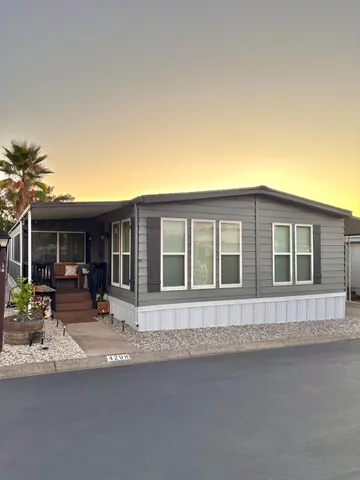 a front view of a house with sitting area