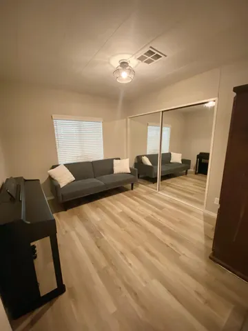 a bathroom with a toilet sink and a mirror