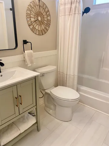 a bedroom with a bed and a mirror