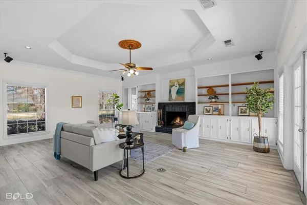 a living room with furniture and a fireplace