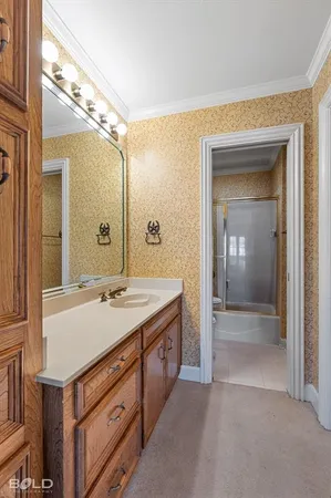 a bathroom with a sink a vanity and a mirror