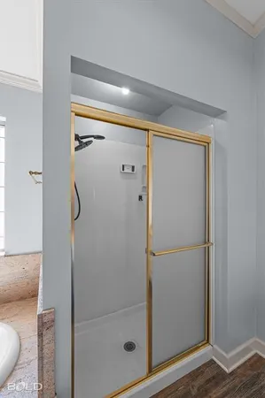 a bathroom with a glass shower door