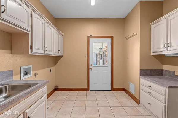 a kitchen with a sink and cabinets