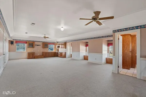 a big room with closet and windows