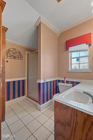 a bed room with a bed and a window