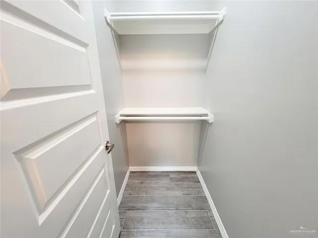 a view of an empty walk in closet