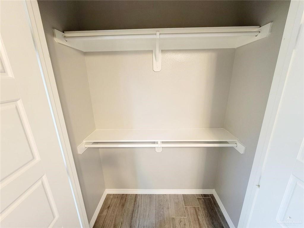 1904 Davenport Street, Unit 1 Weslaco, TX 78596 - Photo 12 of 20 a view of walk in closet with wooden floor