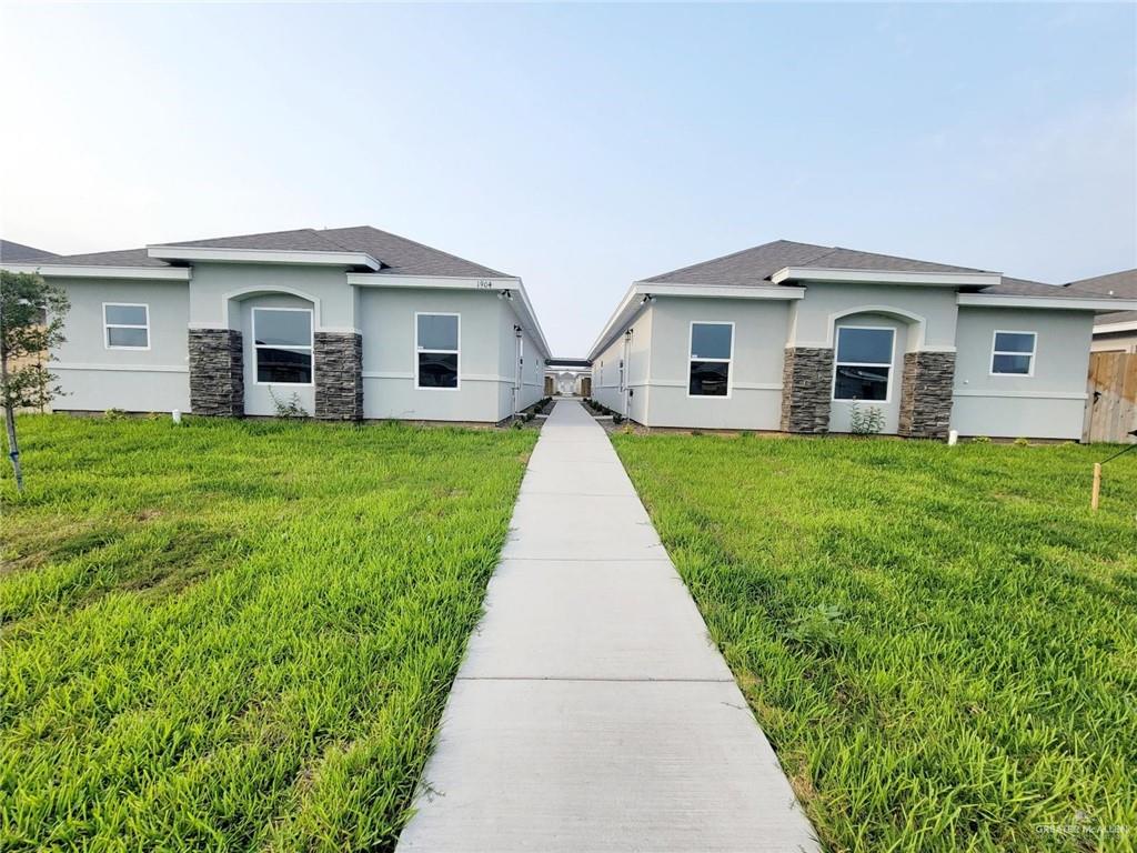 1904 Davenport Street, Unit 1 Weslaco, TX 78596 - Photo 2 of 20 a front view of house with yard and green space