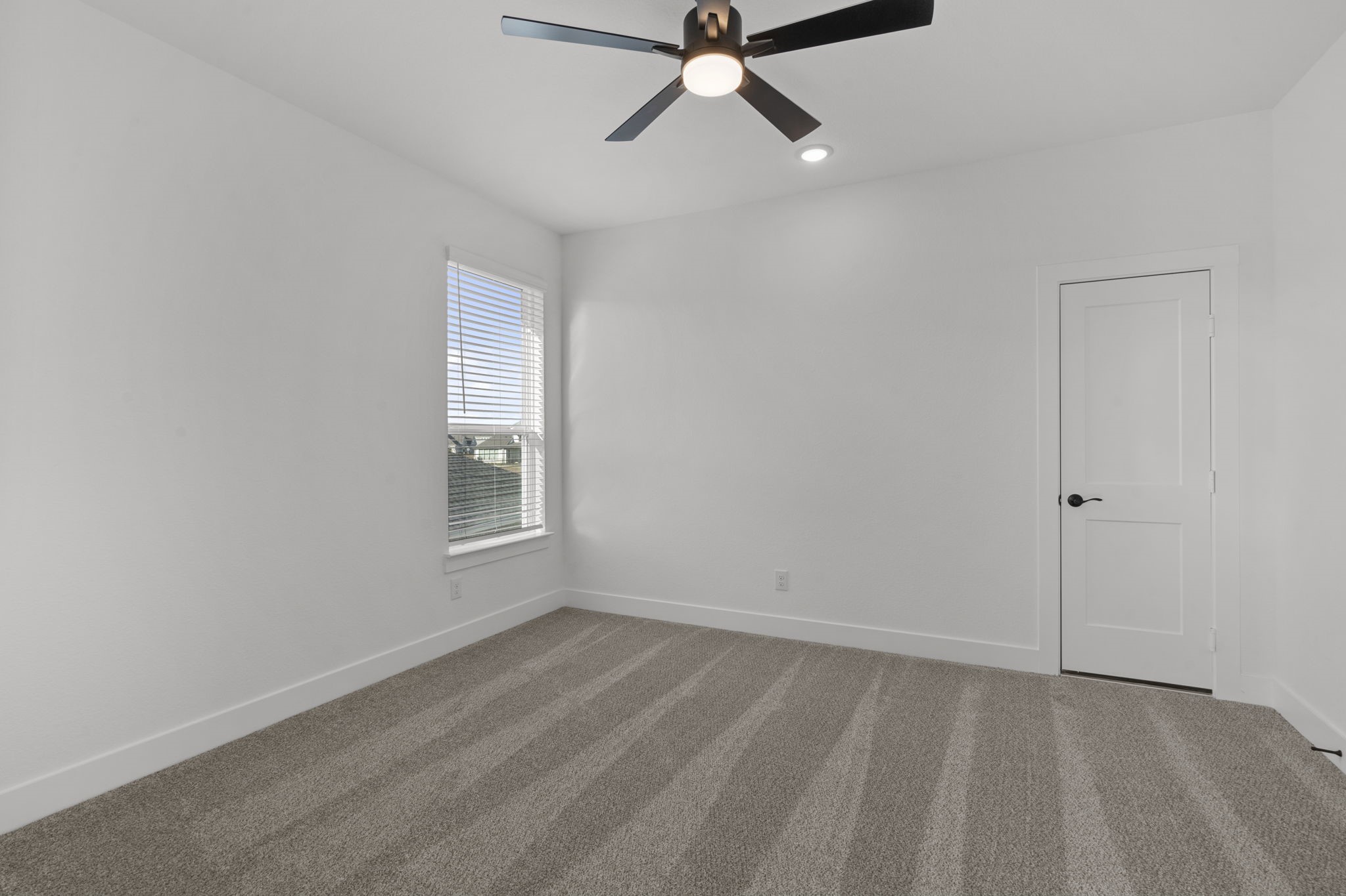 32414 Violet Dancer Court Fulshear, TX 77441 - Photo 31 of 50 a view of a room with a window and a ceiling fan