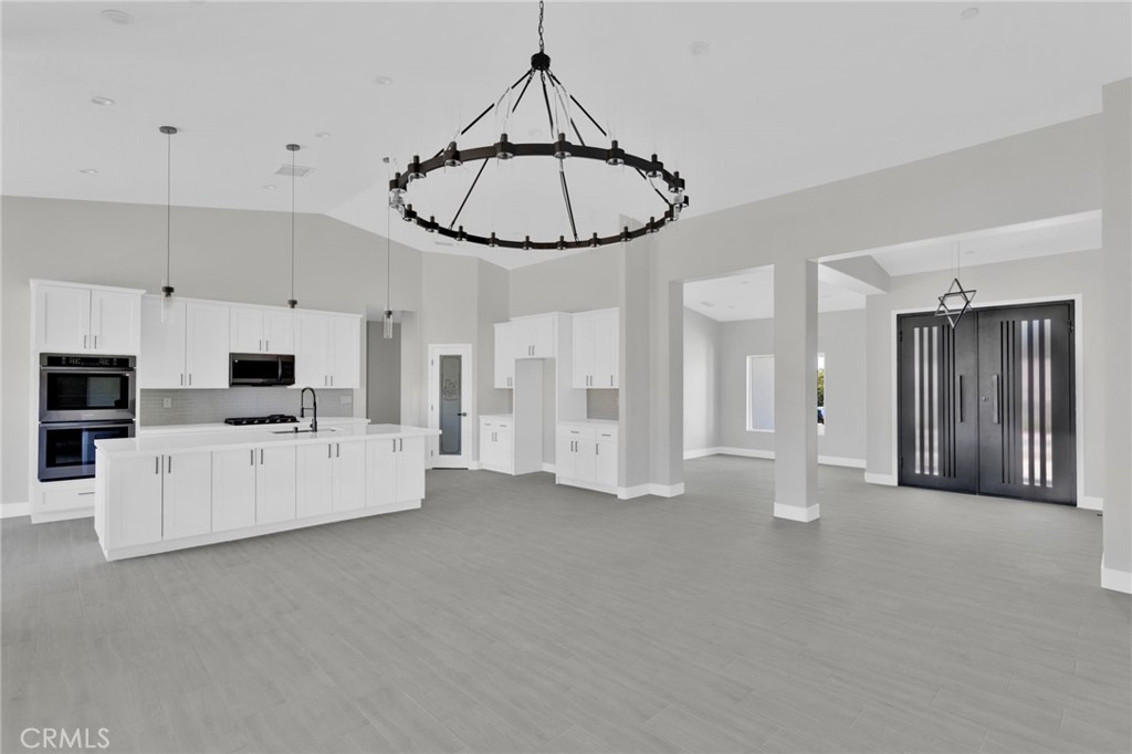 16339 Rimrock Road Apple Valley, CA 92307 - Photo 11 of 50 a view of a livingroom with kitchen appliances